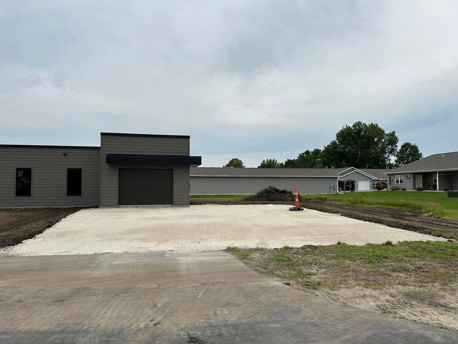 A house with a garage and a driveway in front of it