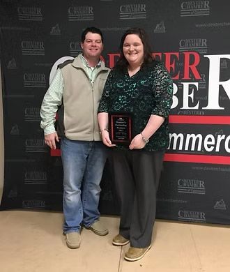 Owners, Ashley & Landon Miller, accepting Dexter's Outstanding Business Award in 2017 