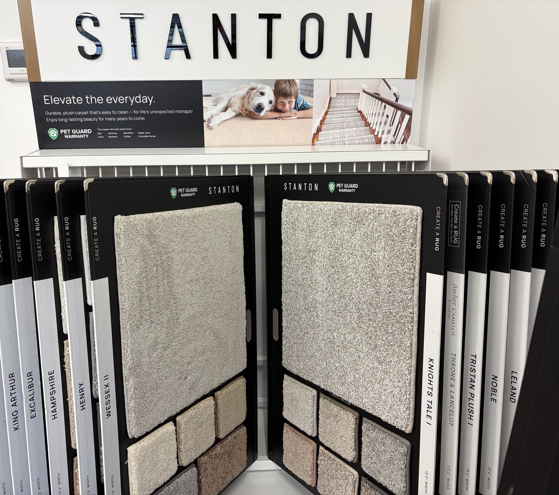 Carpet samples displayed on a rack under a 