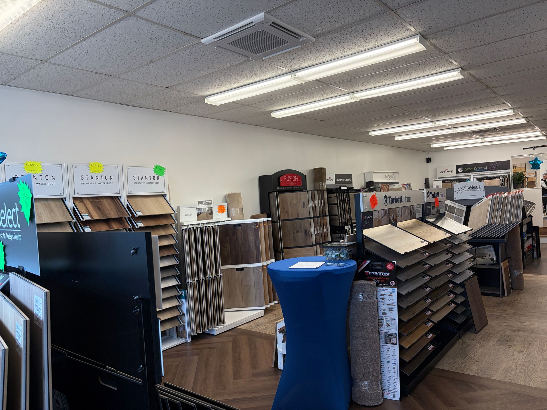 Interior of a flooring store showcasing various samples on display.