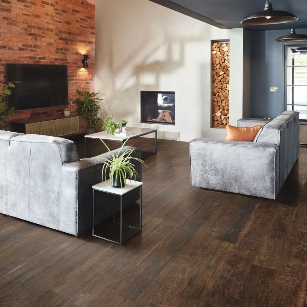 Living room with dark wood floors and gray sofas