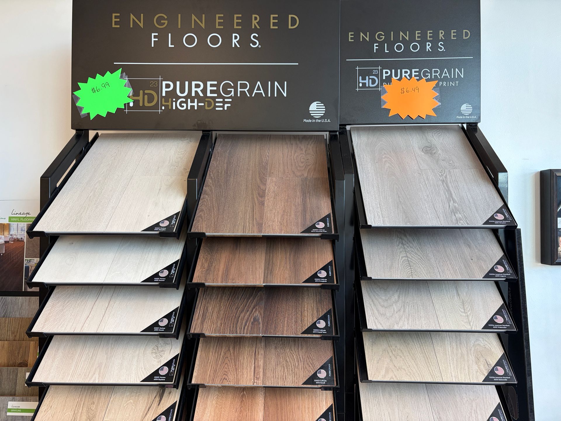Display rack with samples of engineered flooring in various wood tones.