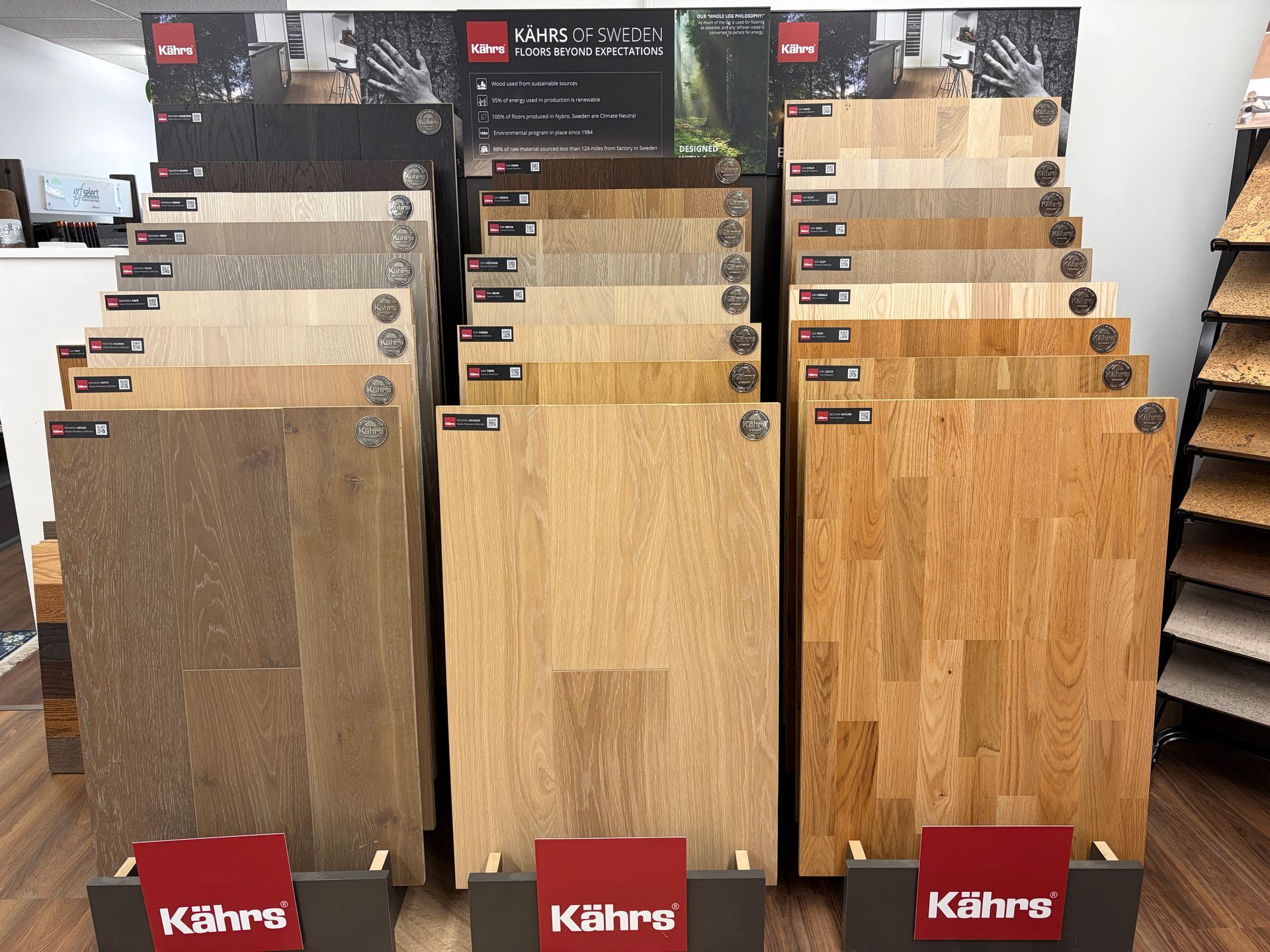 Flooring display with various wood samples in light and medium tones. 