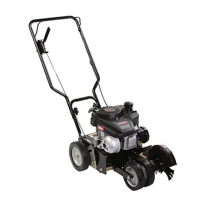 A black lawn mower with a gas engine on a white background.