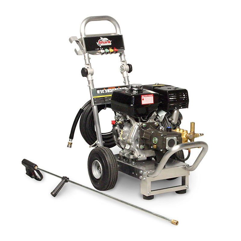 A gas powered pressure washer with a hose attached to it