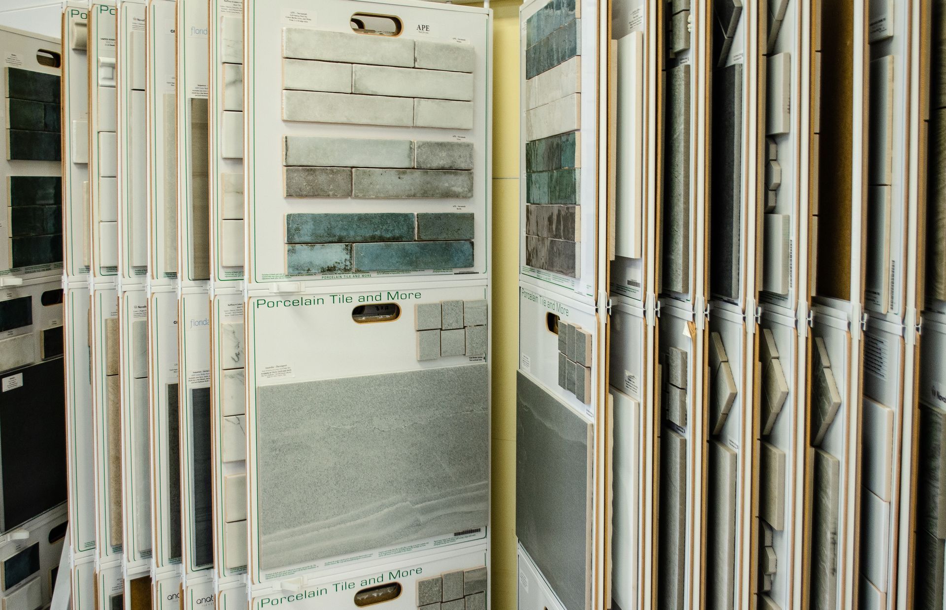 a display case filled with a variety of tiles in a store