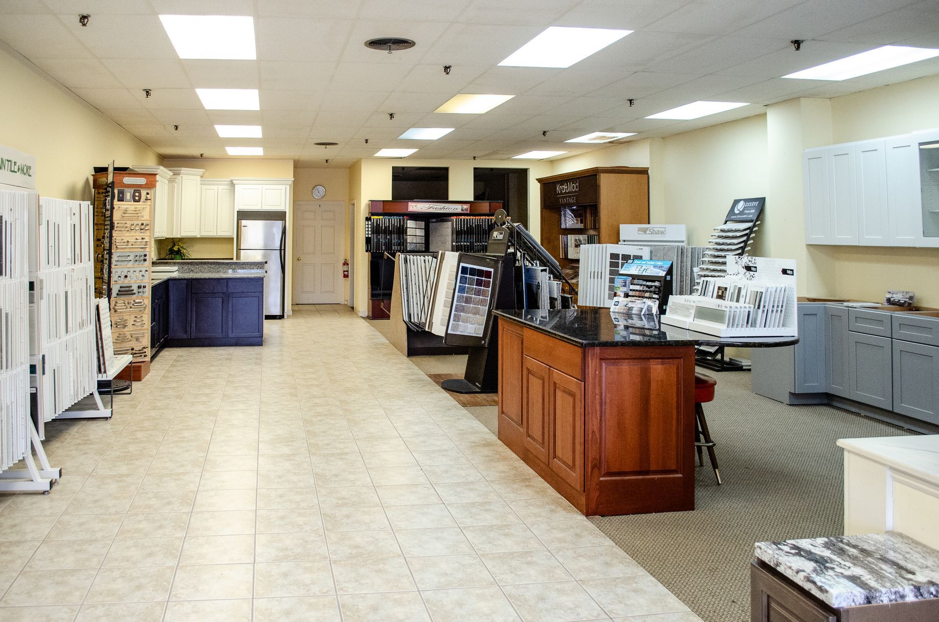 a large room with lots of cabinets and counters