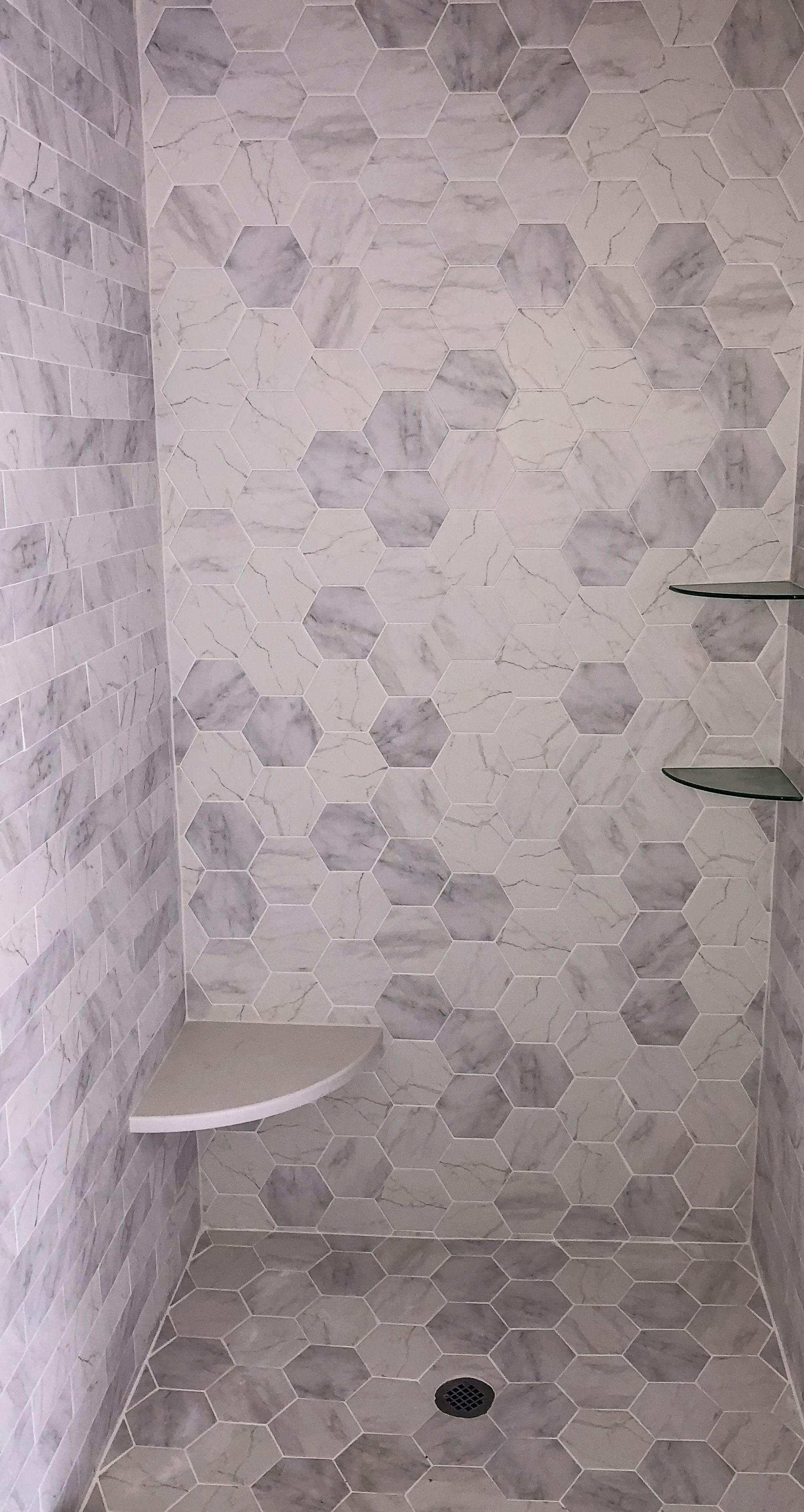 a kitchen with a stove, oven, sink, and cabinets