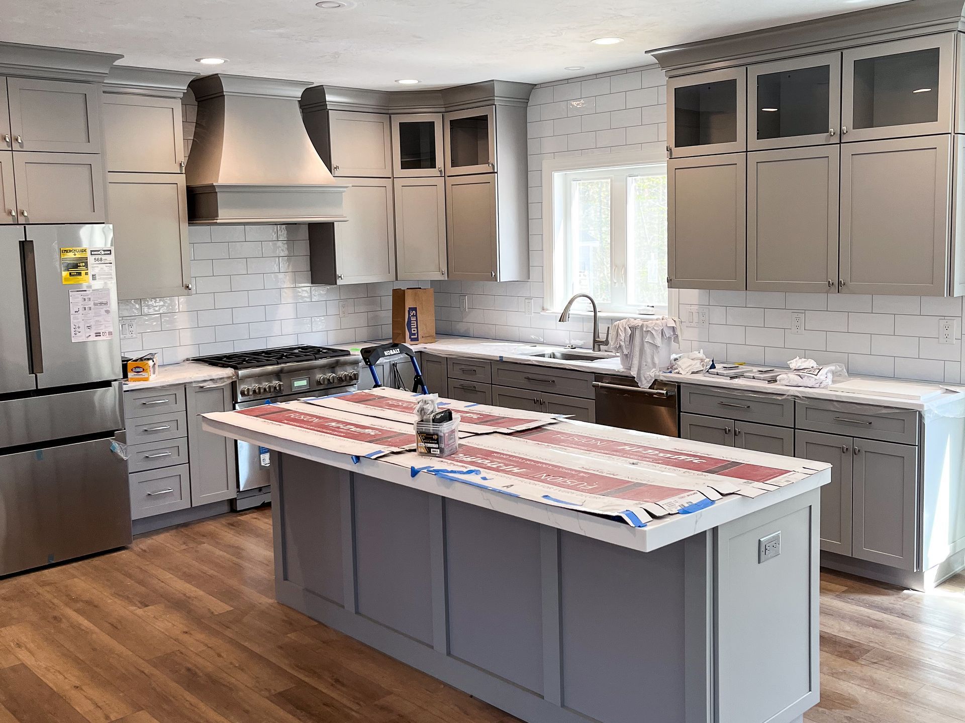 a shower with two shower heads and a bathtub