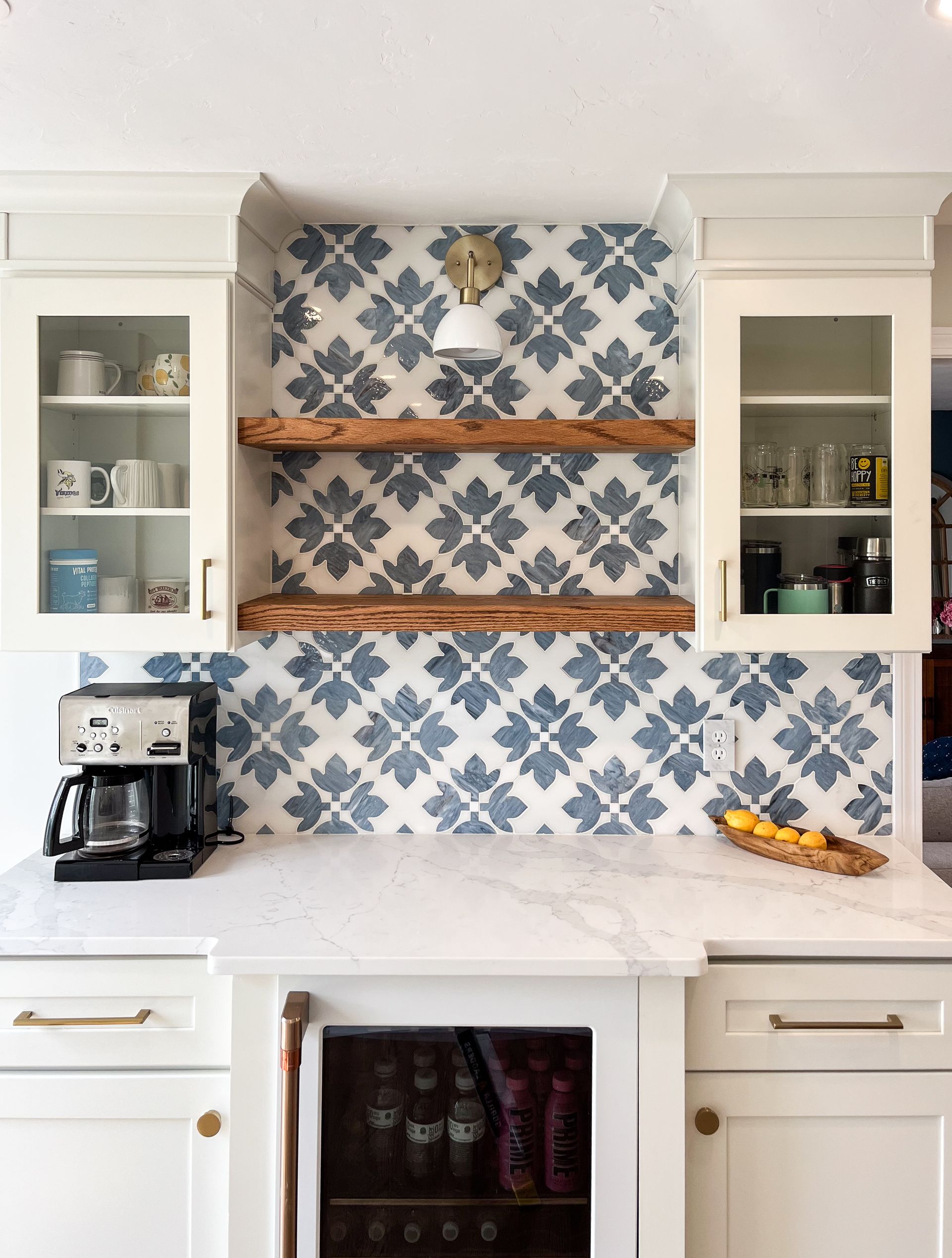 a kitchen with white cabinets and a stove top oven