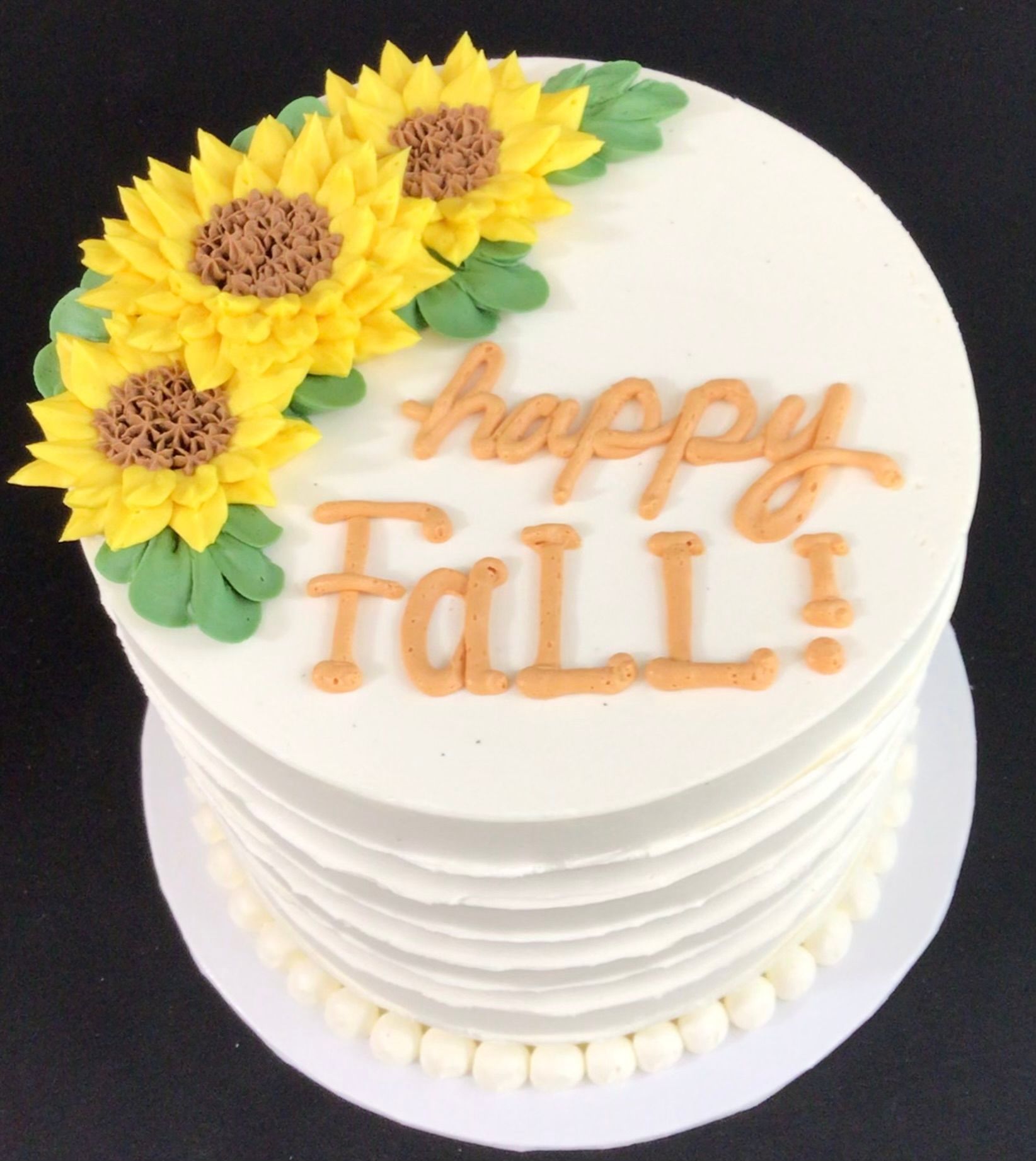 A cake with sunflowers on it