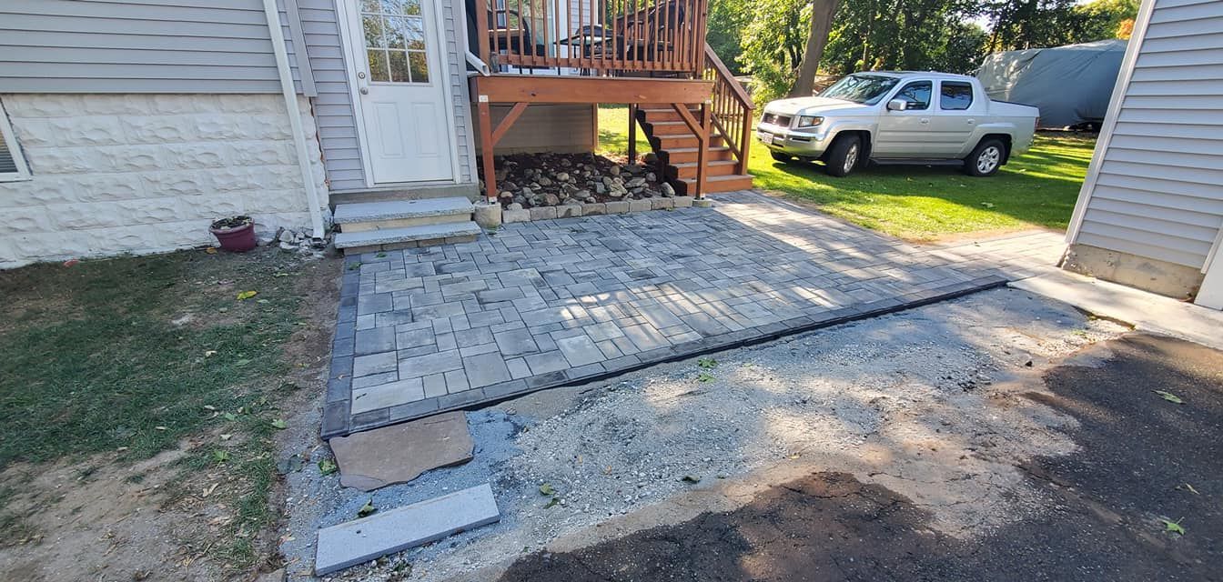 A white truck is parked in front of a house.