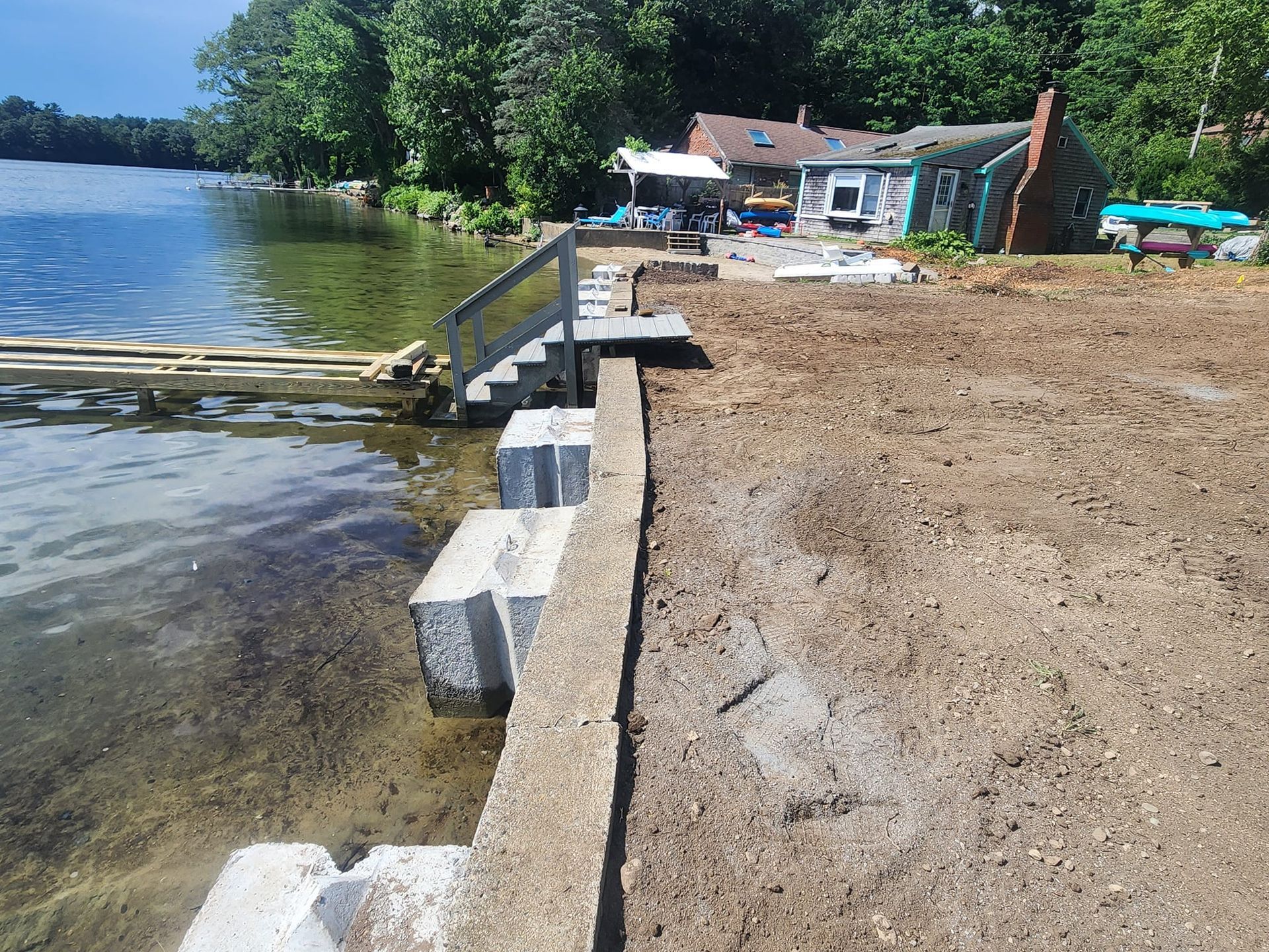 A house is being built on the shore of a lake