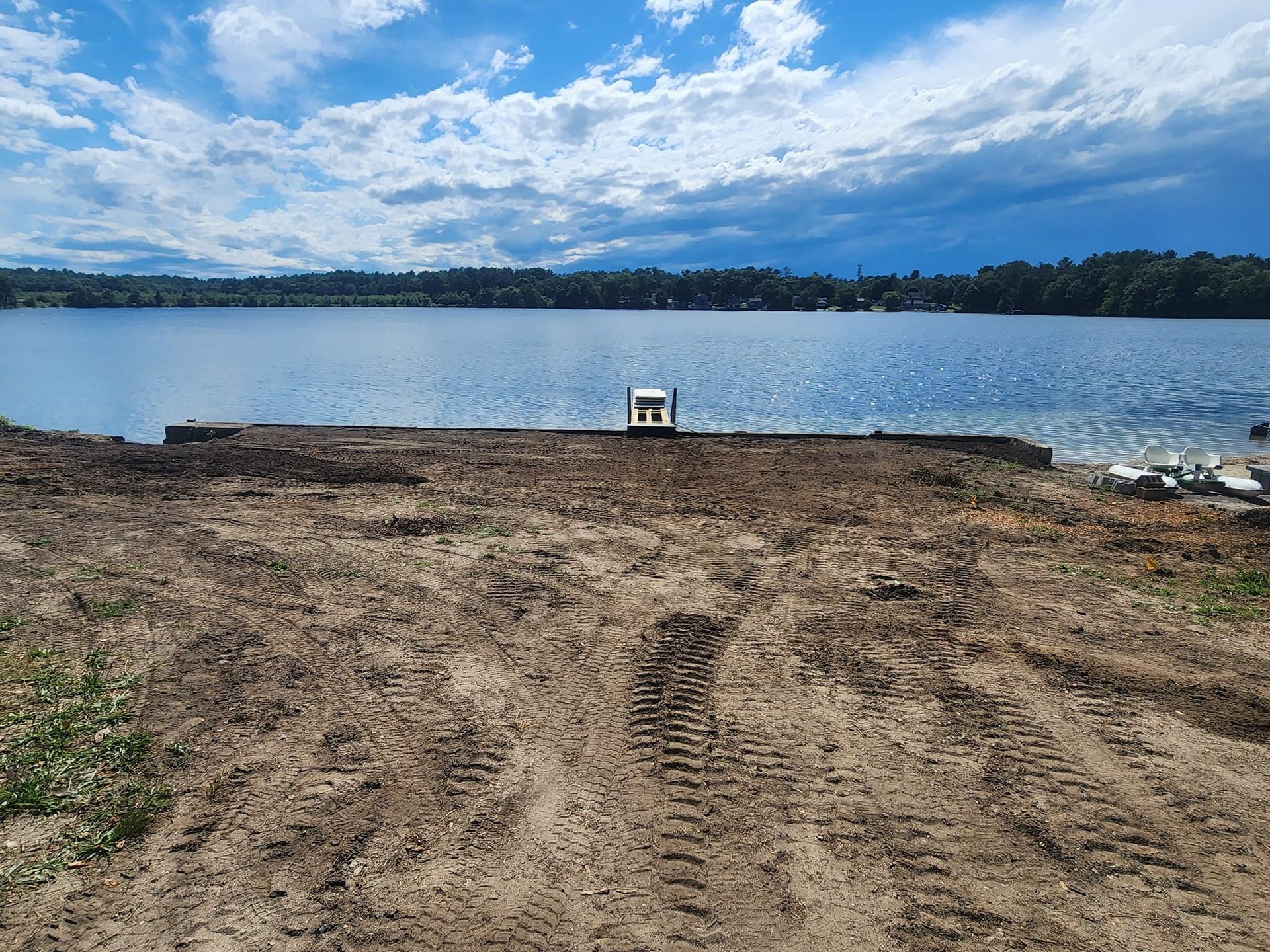 A dock is being built on the shore of a lake.