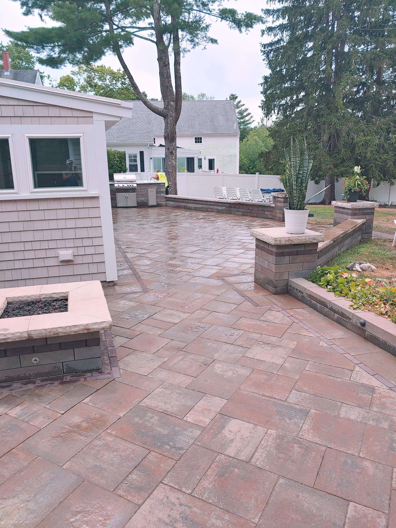 There is a fire pit in the middle of the patio.