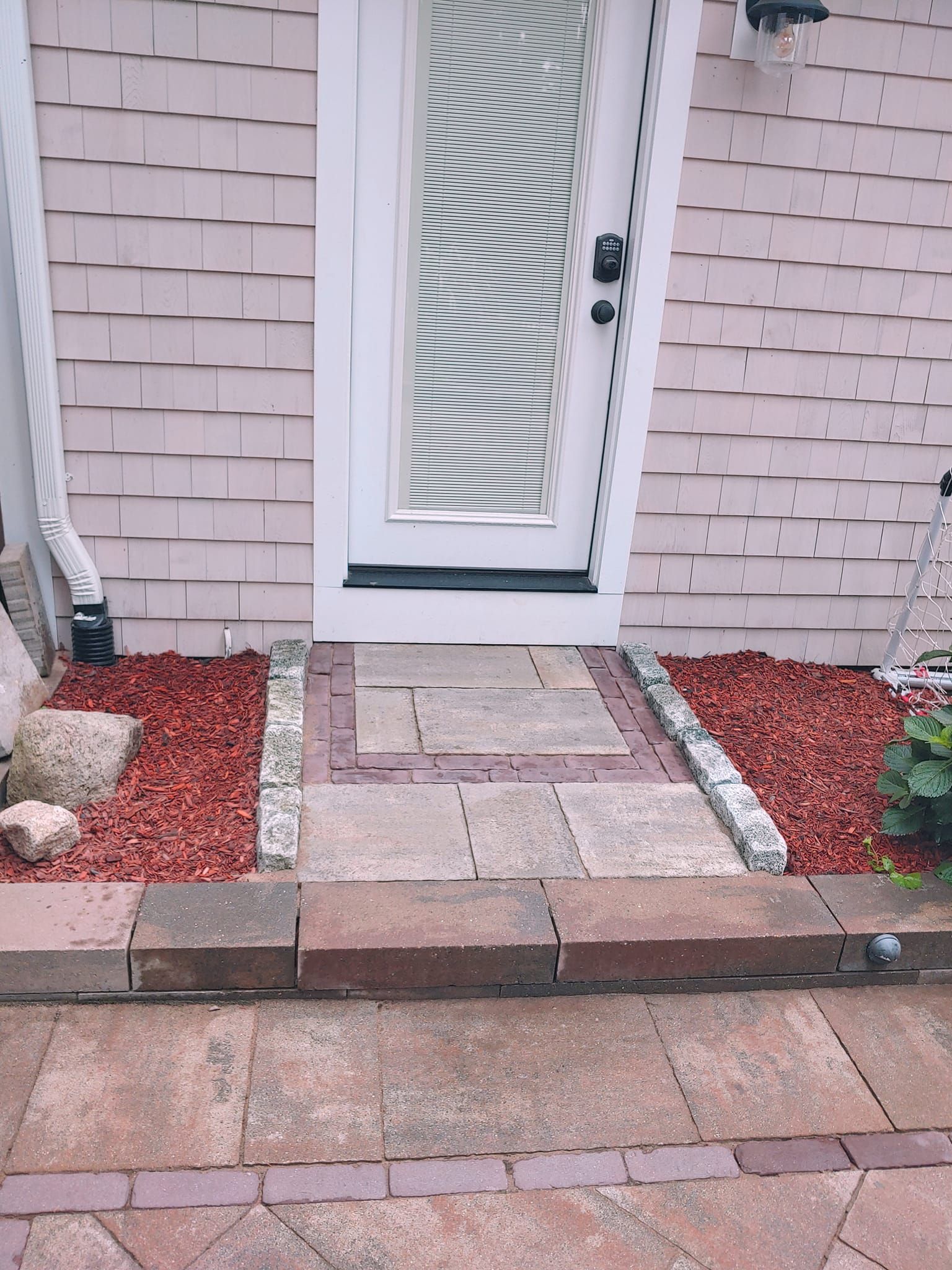 A walkway leading to the front door of a house