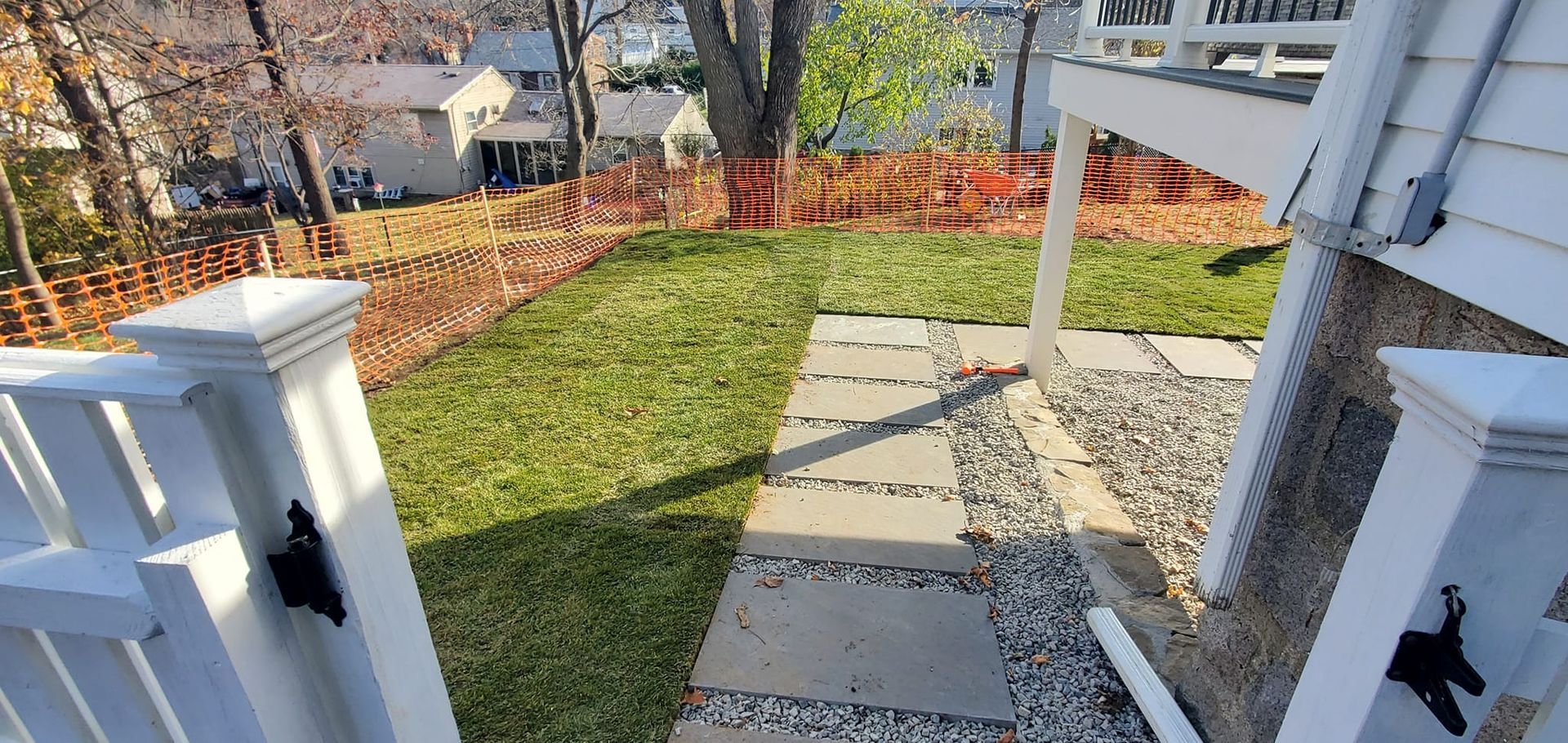An aerial view of a walkway leading to a house.