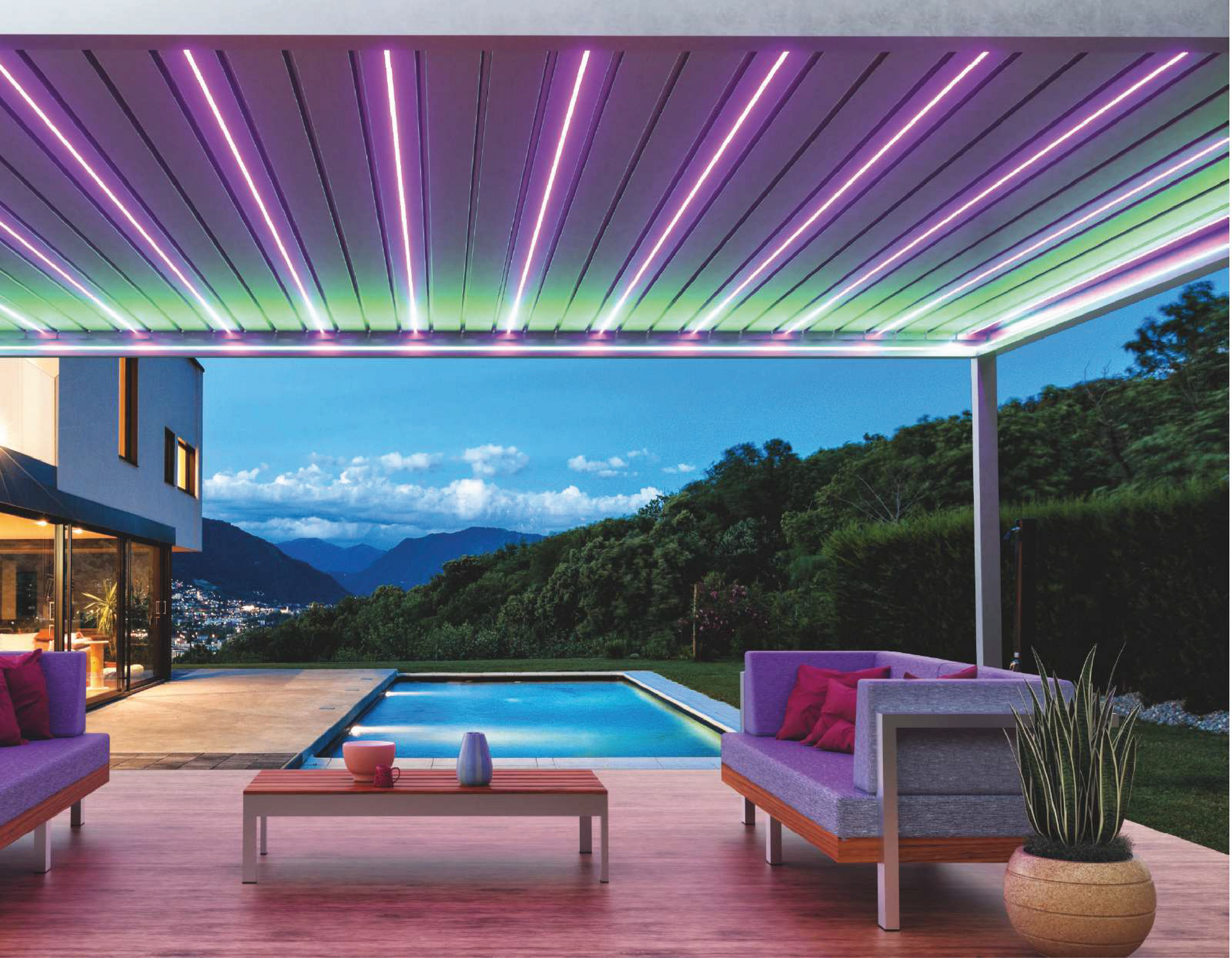 A patio with a couch and a table next to a pool.