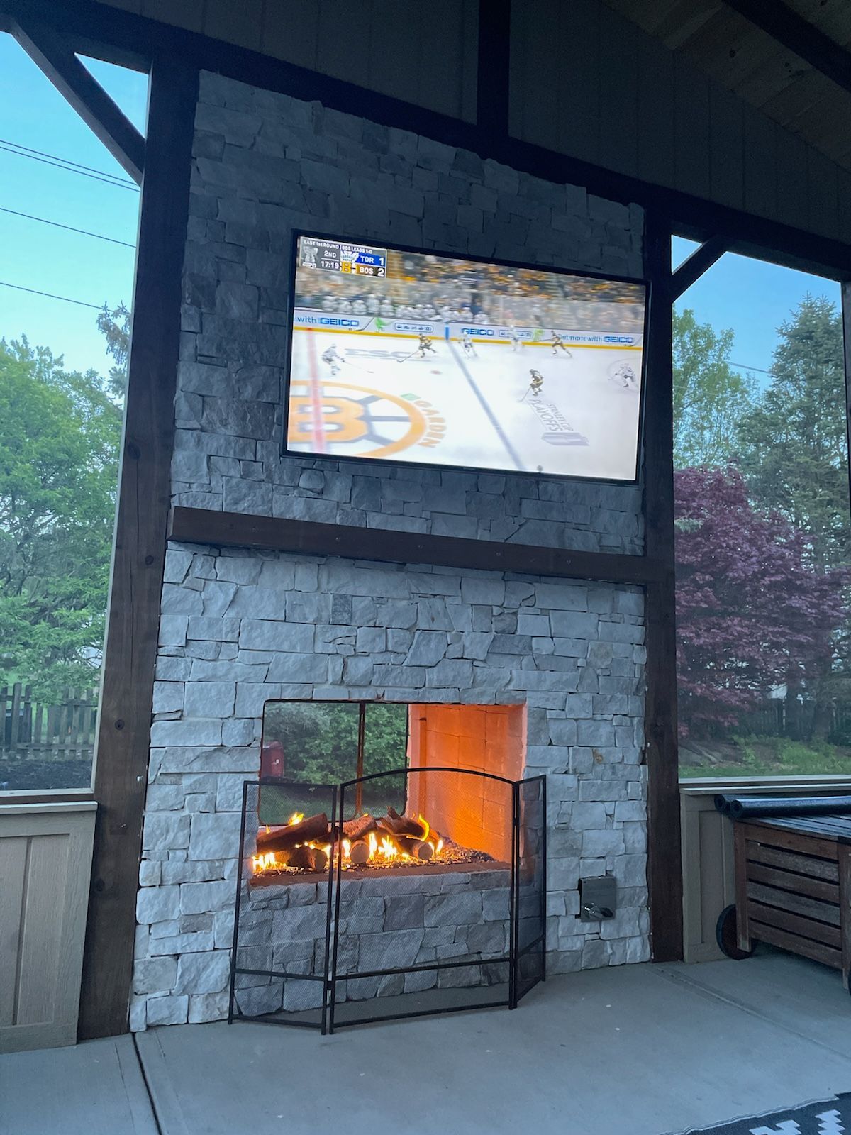 A fireplace with a television mounted above it.