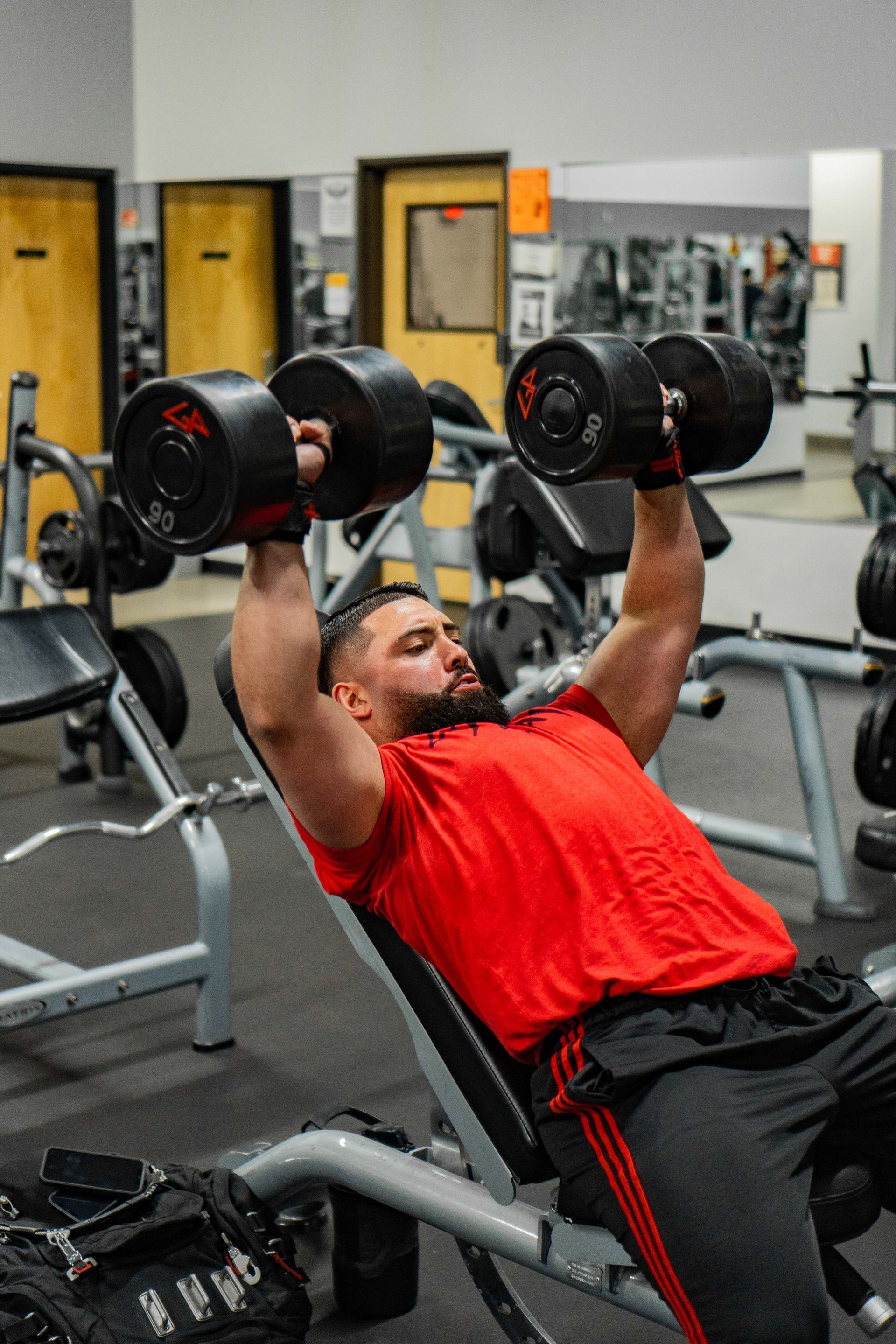Fit man lifting weights