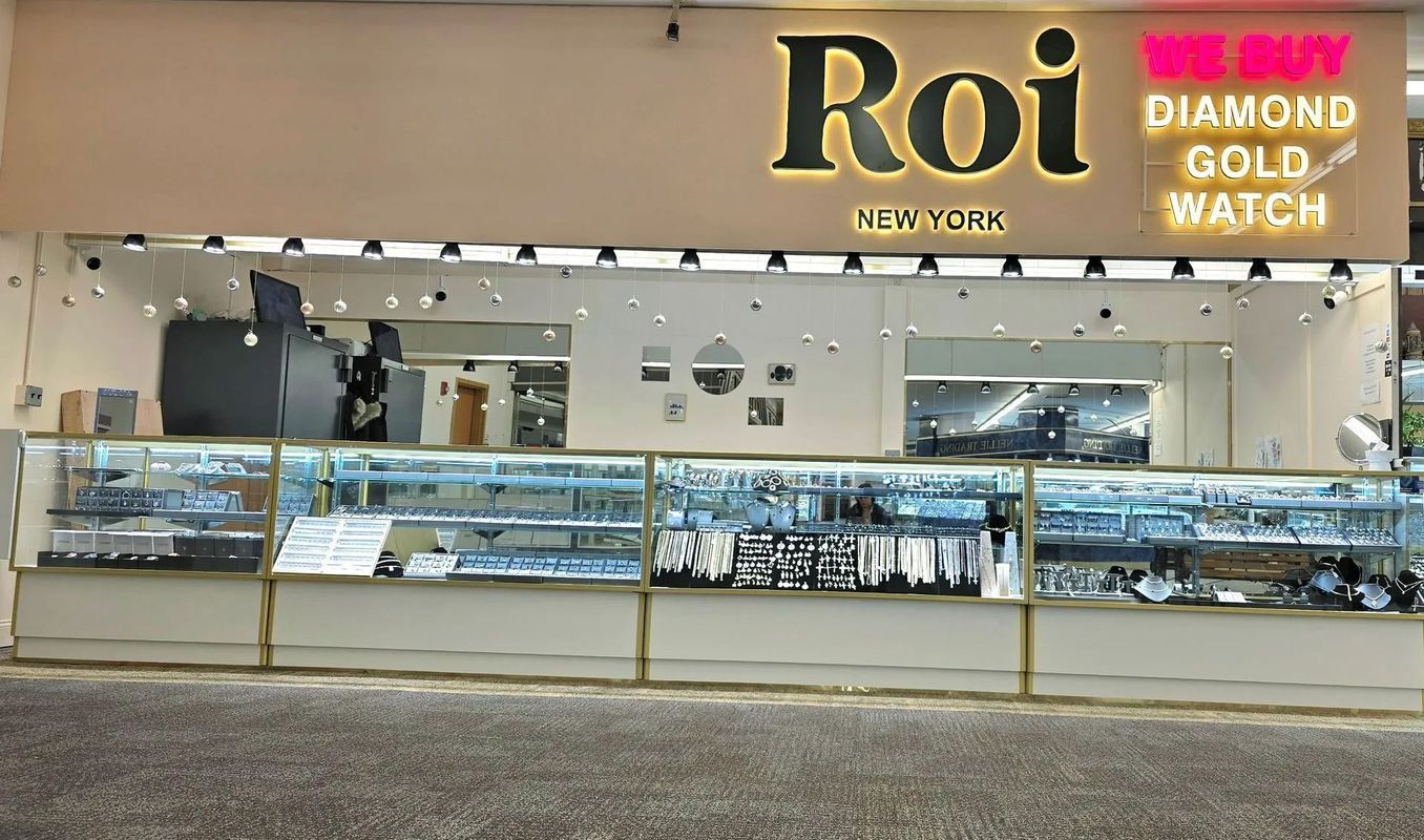Roi Jewelry store exterior with display cases of jewelry. Sign says 