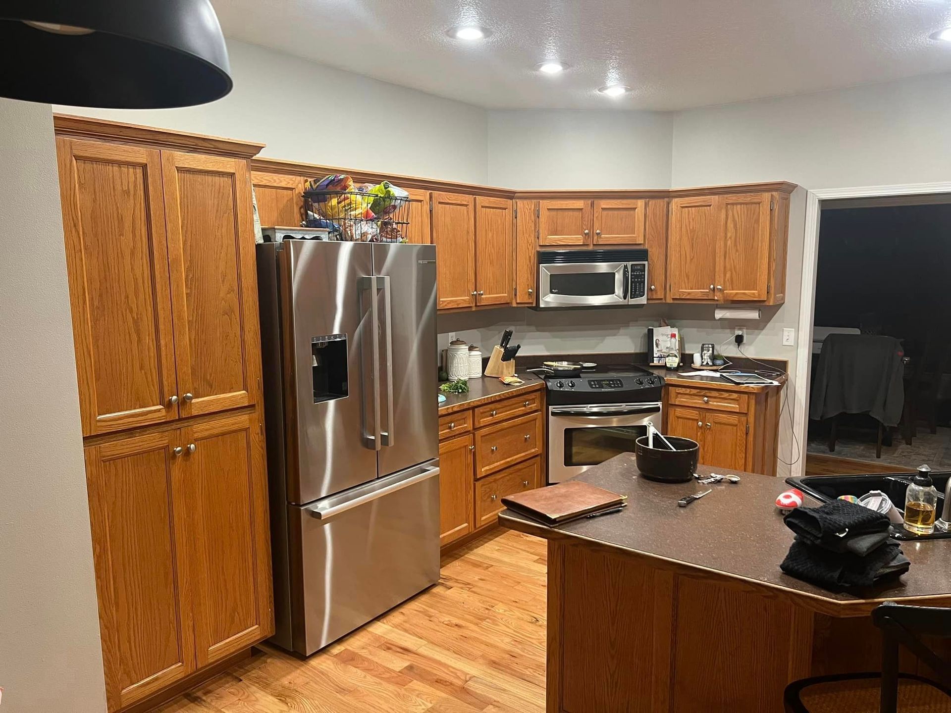 Kitchen with wood cabinets, stainless steel appliances, and a central island.