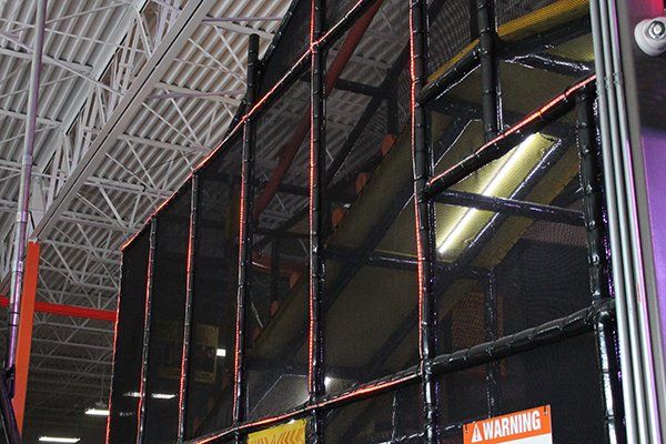 A warning sign is on the side of a building