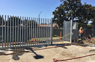Man installing iron fence