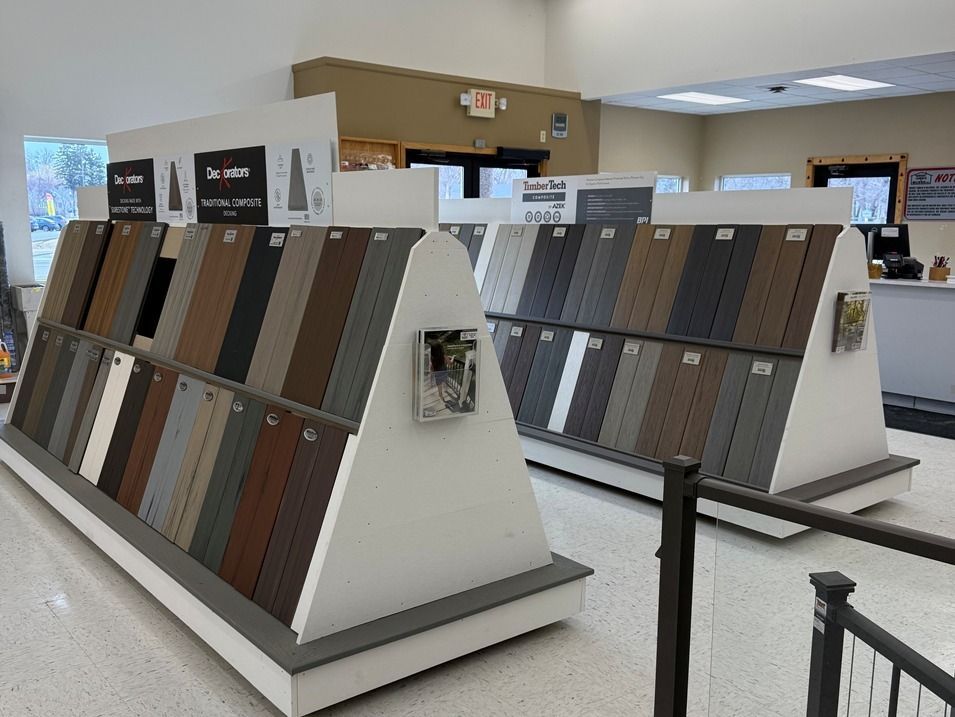 Flooring sample display racks with rows of carpet and tile swatches in a showroom