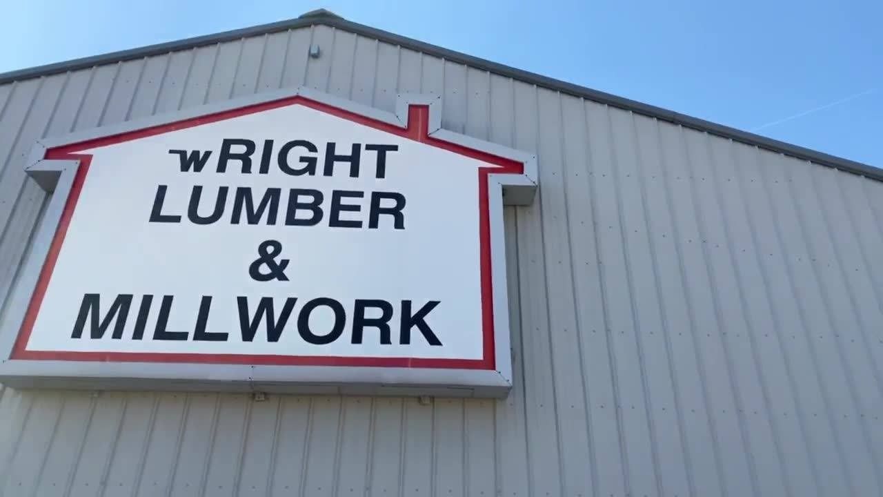 Wright Lumber & Millwork sign on a gray building