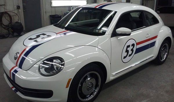 A white car with the number 53 on it