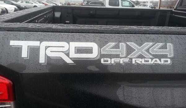 The back of a black truck with a trd4x4 off road sticker on it.