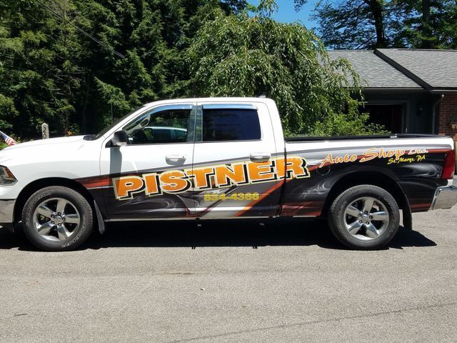 A white truck with the word pistner on it