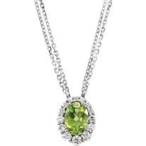 Silver necklace with an oval green gemstone pendant surrounded by small white gemstones.