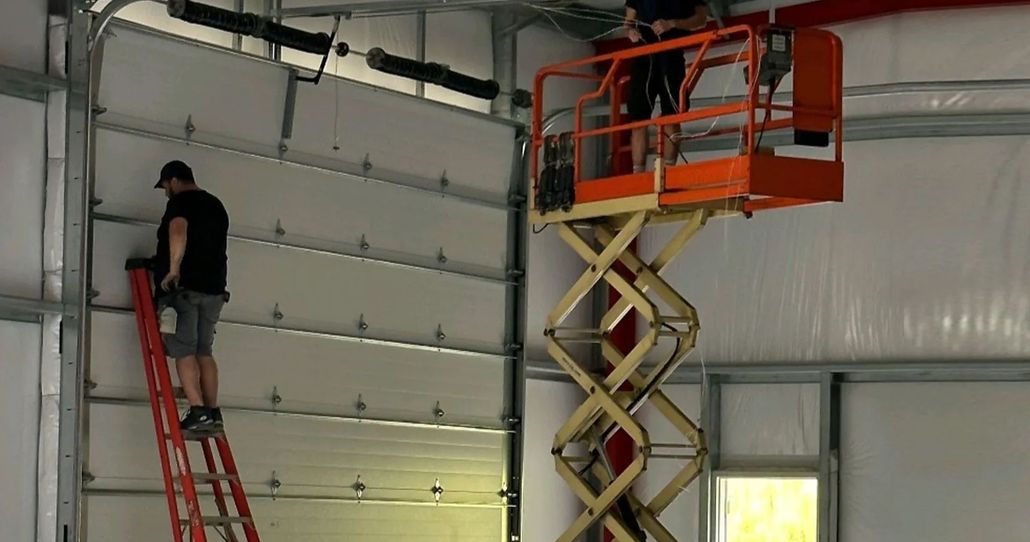 LiftMaster garage door opener with integrated camera and LED light. Mounted on ceiling.