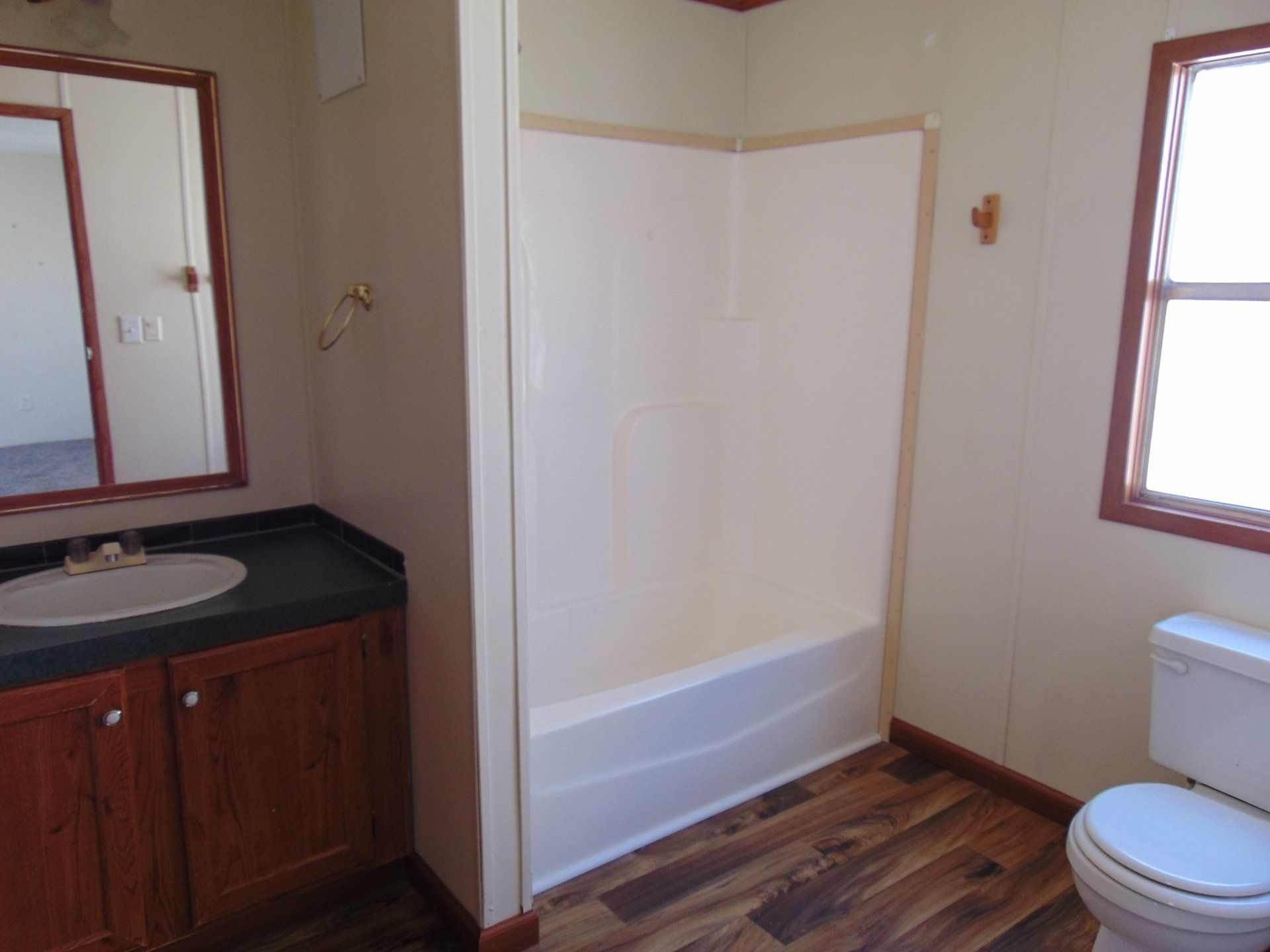 A bathroom with a sink, toilet and bathtub.