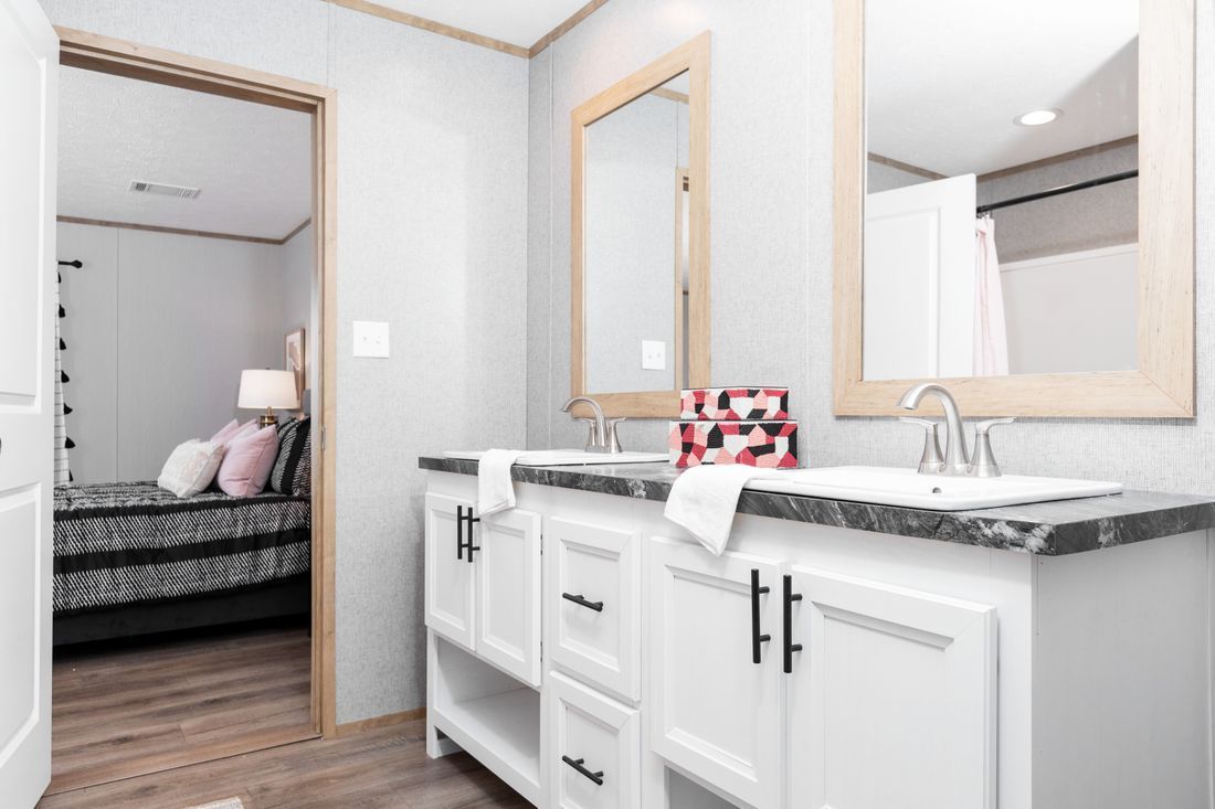 a bathroom with two sinks
