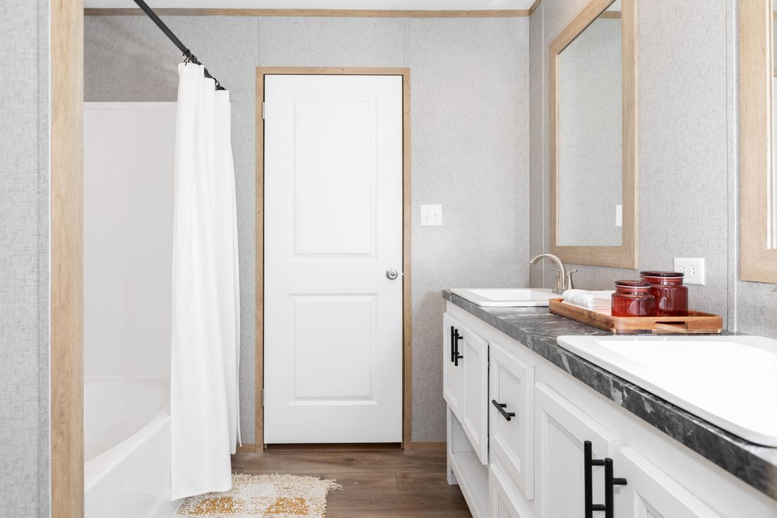 a bathroom with two sinks