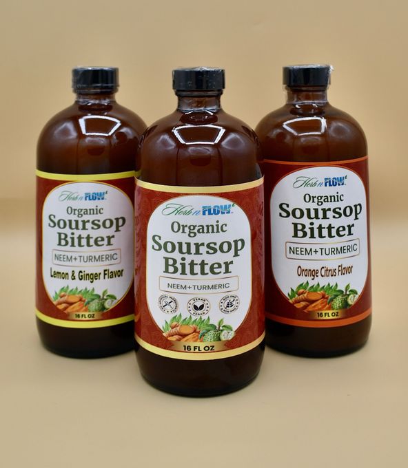 Three brown bottles of organic soursop bitter on a beige background