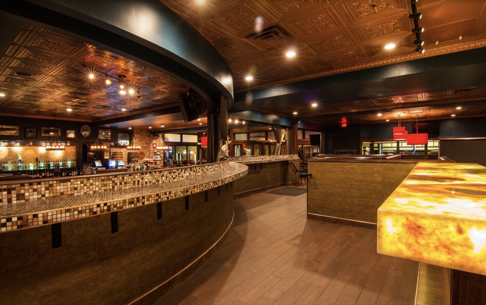 A large room with a bar in the middle of it