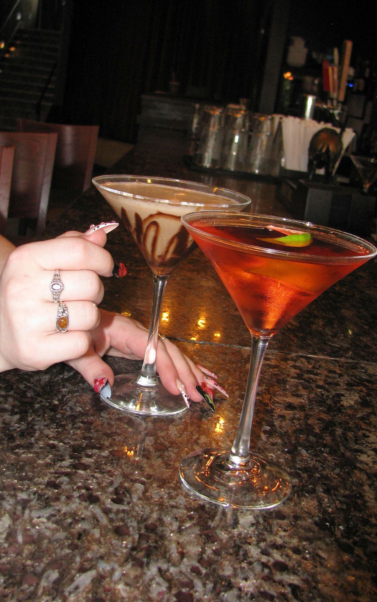 Two martini cocktails on a bar counter