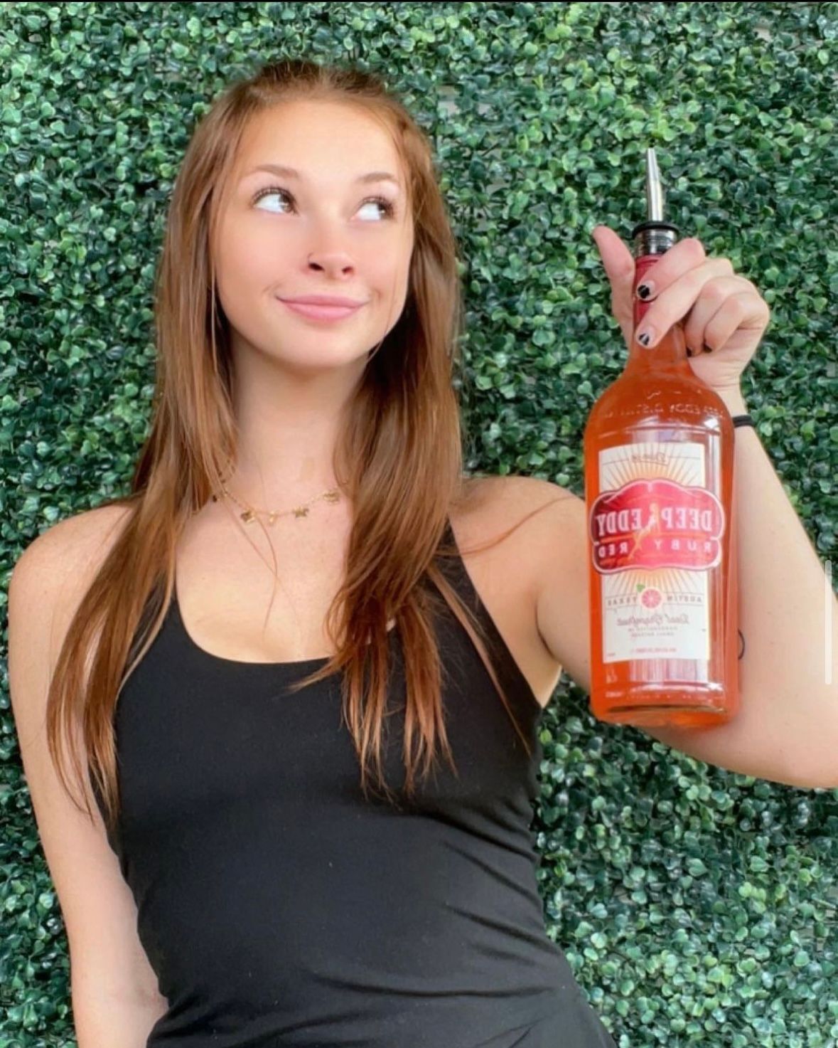 girl with a deep eddy bottle