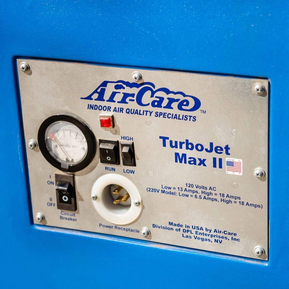 Air-Care TurboJet Max II control panel: gauge, switches, electrical outlet, on blue surface.