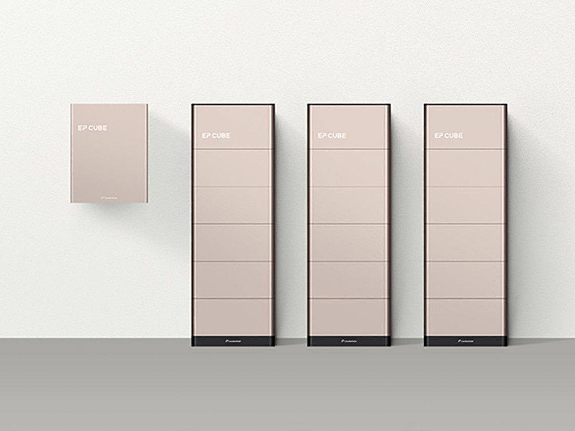 Minimalist product lineup of pale pink cabinets on a white wall, showing one wall unit and three tall floor units.