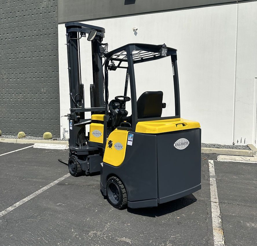 A yellow and black forklift is parked in a parking lot