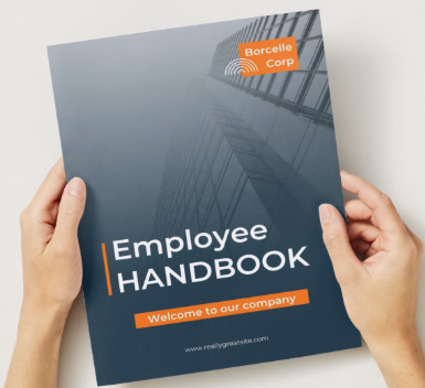 Small business owner reviewing an employee handbook with an HR consultant.