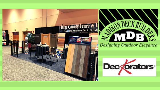 Madison Deck Builders booth at a trade show with deck samples and Decorators logo.