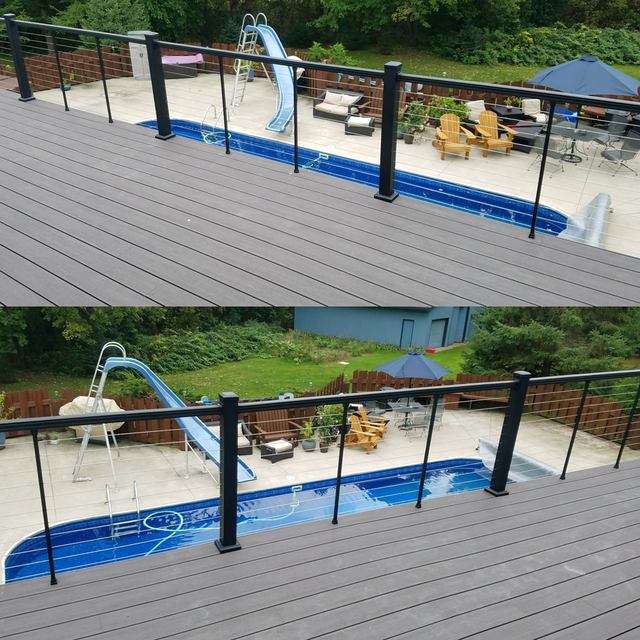 Above view of a deck with a pool and slide, furniture, and railing.