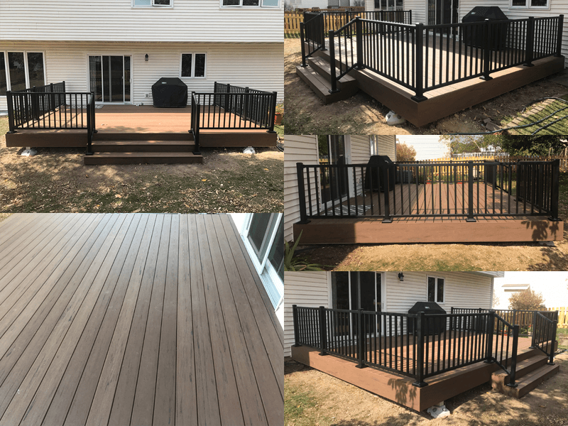 Composite deck with black railing and steps against a white house.