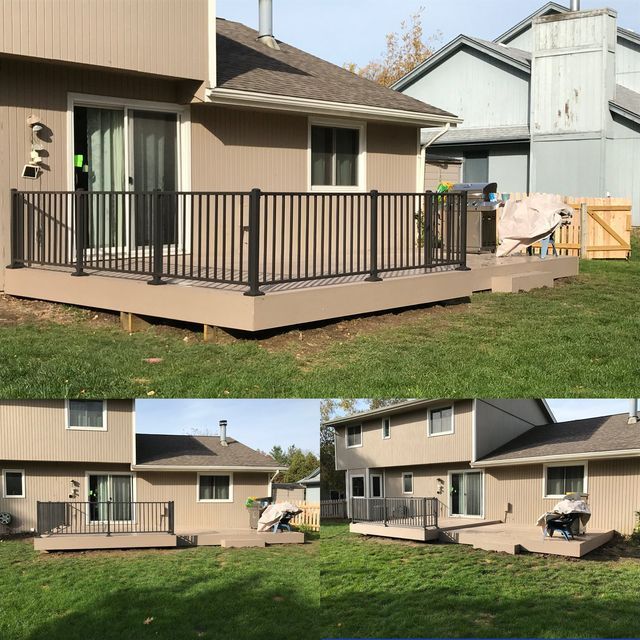 Composite deck with black railing and tan siding on a house.
